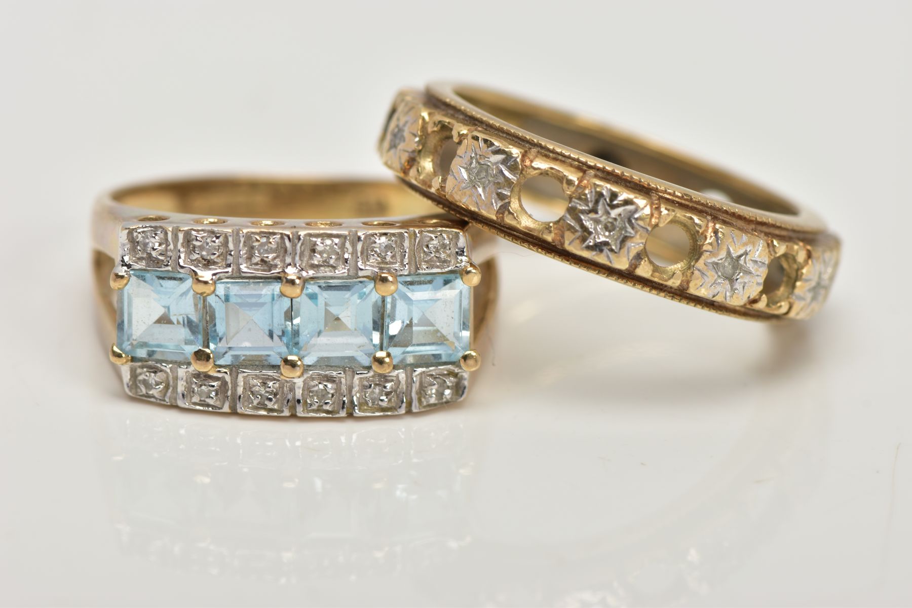 TWO 9CT GOLD GEM SET DRESS RINGS, the first centring on a row of four square cut light blue topaz, - Image 2 of 4