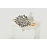 A 9CT YELLOW GOLD DIAMOND DRESS RING, the tiered cluster set throughout with approximately forty-