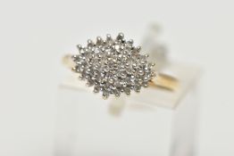 A 9CT YELLOW GOLD DIAMOND DRESS RING, the tiered cluster set throughout with approximately forty-