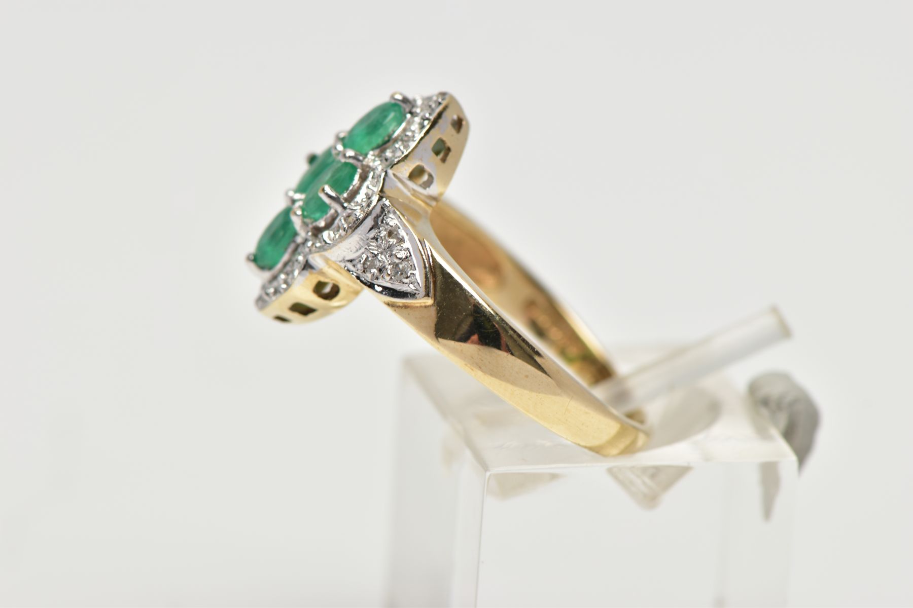 A 9CT YELLOW AND WHITE GOLD EMERALD AND DIAMOND DRESS RING, set with four oval cut emeralds, - Image 2 of 4
