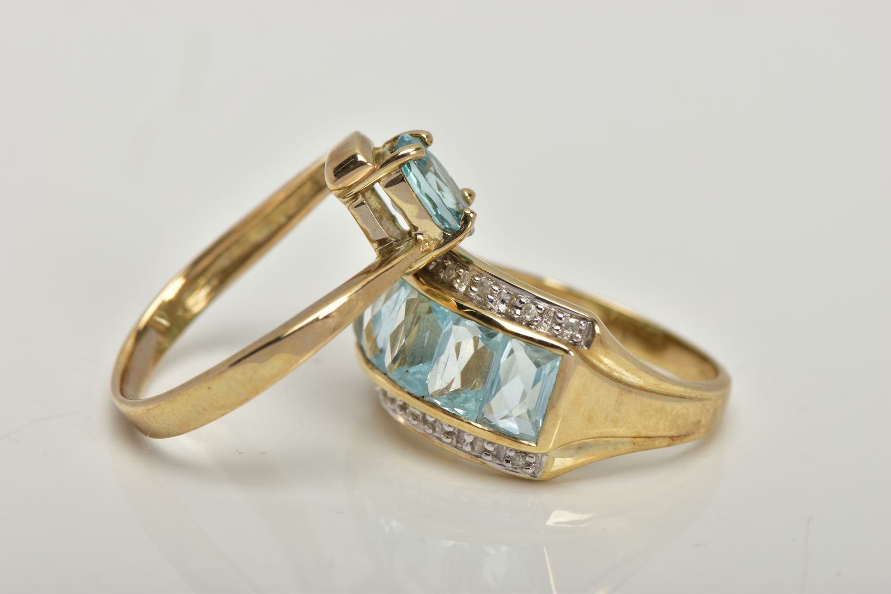 TWO 9CT GOLD GEM SET DRESS RINGS, the first centring on a slightly raised row of five rectangular, - Image 3 of 4