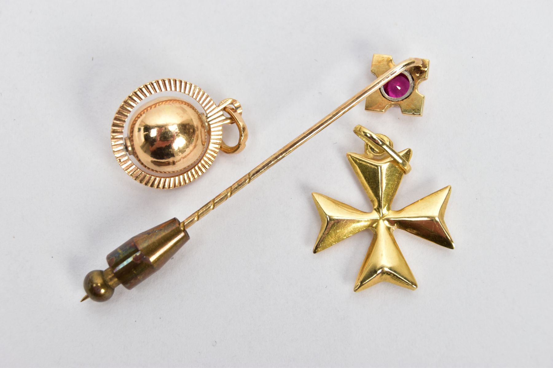 TWO YELLOW METAL CHARMS AND A STICK PIN, to include a puffy Maltese cross charm fitted with an - Image 2 of 3