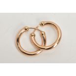 A PAIR OF 9CT GOLD EARRINGS, each hollow ear hoop of plain polished design with spherical bead