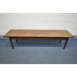 A 1960'S LONG RECTANGULAR DANISH STYLE SOLID MAHOGANY TOP COFFEE TABLE, on a teak base with