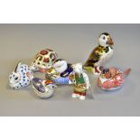 SEVEN ROYAL CROWN DERBY PAPERWEIGHTS, in the forms of a Puffin height 12cm (second quality with
