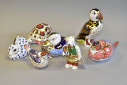 SEVEN ROYAL CROWN DERBY PAPERWEIGHTS, in the forms of a Puffin height 12cm (second quality with