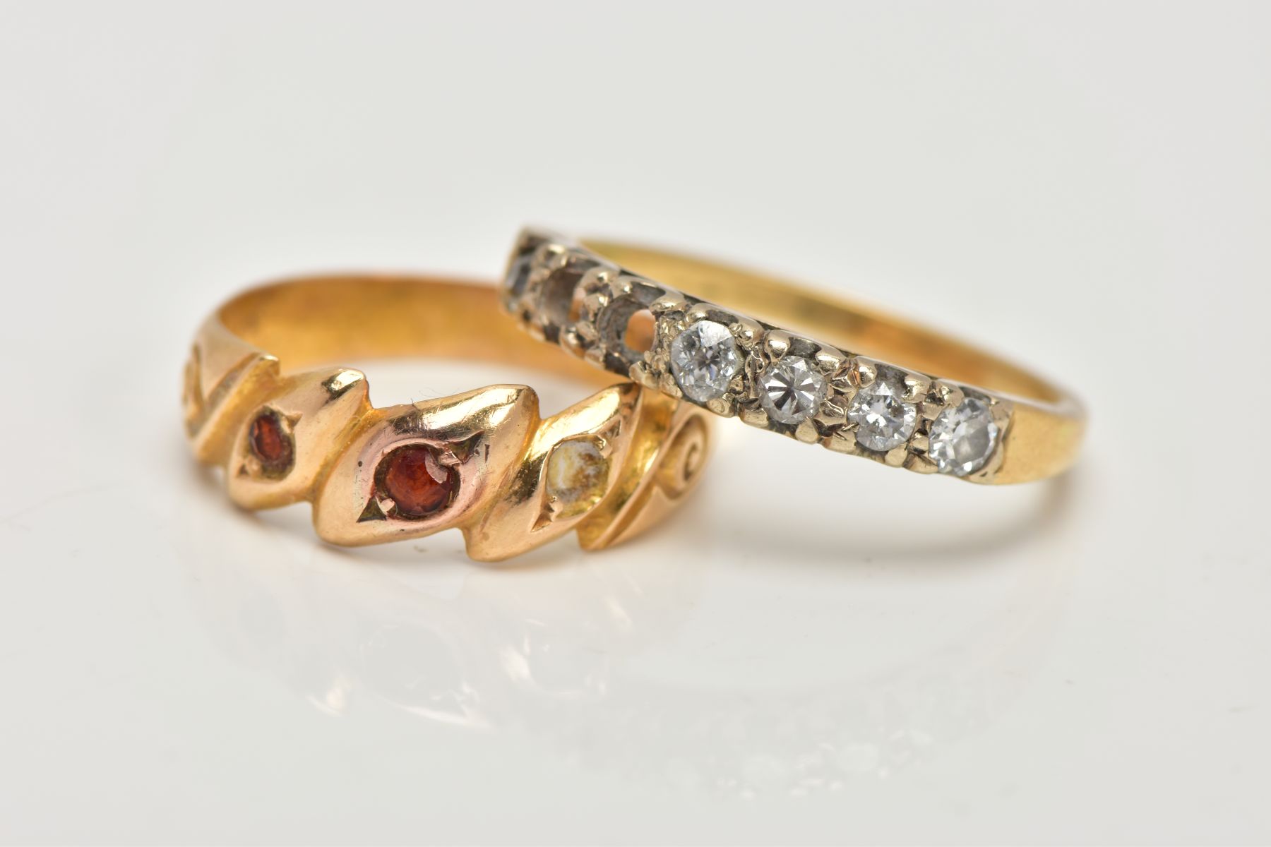 AN 18CT GOLD RING AND A DIAMOND HALF ETERNITY RING, the first a late Victorian ring, designed with