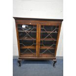 A GEORGE III MAHOGANY ASTRAGAL GLAZED TWO DOOR BOOKCASE, enclosing three adjustable shelves, on