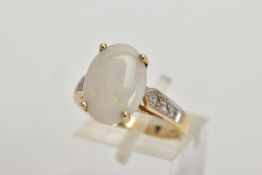 A 9CT GOLD OPAL AND DIAMOND DRESS RING, four claw set white opal cabochon showing flashes of blue,