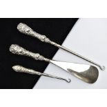 TWO SILVER HANDLED BUTTON HOOKS AND A SILVER HANDLED SHOE HORN, a button hook and shoe horn silver