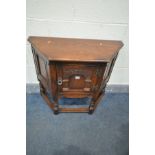 A LATE 20TH CENTURY OAK SINGLE DOOR CREDENCE CABINET, with carved panel door, width 81cm x depth