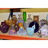 A QUANTITY OF COLOURED GLASS LAMP SHADES AND VASES, including a hinged lid glass inkwell, an amber