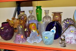 A QUANTITY OF COLOURED GLASS LAMP SHADES AND VASES, including a hinged lid glass inkwell, an amber