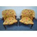 A PAIR OF REPRODUTION VICTORIAN STYLE MAHOGANY TUB CHAIRS, covered in floral upholstery with in a