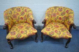 A PAIR OF REPRODUTION VICTORIAN STYLE MAHOGANY TUB CHAIRS, covered in floral upholstery with in a