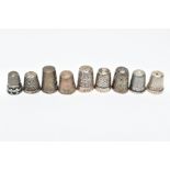 AN ASSORTMENT OF SILVER AND WHITE METAL THIMBLES, five decorative silver thimbles, each hallmarked