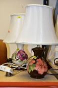 TWO MOORCROFT POTTERY TABLE LAMPS WITH CREAM SHADES, comprising a coral 'Hibiscus' design on a