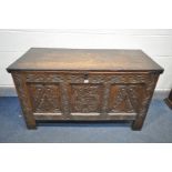A GEORGIAN CARVED OAK PANELLED COFFER, width 124cm x depth 56cm x height 70cm (condition:-historical