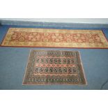 A PINK GROUND PAKISTAN BOKHARA WOOLLEN REGTANGULAR RUG, with eighteen medallions, length 117cm x