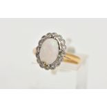 A 9CT GOLD OPAL AND DIAMOND CLUSTER RING, of an oval form, centring on an oval cut opal cabochon,