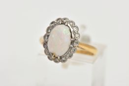 A 9CT GOLD OPAL AND DIAMOND CLUSTER RING, of an oval form, centring on an oval cut opal cabochon,