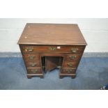 A GEORGIAN STYLE MAHOGANY KNEE HOLE DESK, with a single long drawer, over two banks of three drawers