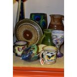 A GROUP OF ART POTTERY including a stoneware jug signed on base 'Nic Collins', a 'Grayshott' peacock