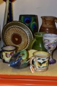 A GROUP OF ART POTTERY including a stoneware jug signed on base 'Nic Collins', a 'Grayshott' peacock