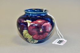 A SMALL MOORCROFT POTTERY BALUSTER VASE, decorated with tube lined pink and purple Pansy pattern