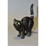 A WEDGWOOD ETRURIA BLACK BASALT CAT WITH GREEN GLASS EYES DESIGNED BY ERNEST LIGHT, impressed marks,