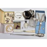 AN ASSORTMENT OF MAINLY SILVER AND COSTUME JEWELLERY, to include an early 20th century molded