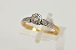 A YELLOW AND WHITE METAL SINGLE STONE DIAMOND RING, collet mounted round brilliant cut diamond,