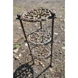 A WROUGHT IRON CIRCULAR THREE TIER STAND, with open fretwork, diameter 29cm x height 67cm (