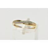 A 9CT YELLOW GOLD DIAMOND CROSSOVER BAND RING, set with thirteen single cut diamonds, claw set to