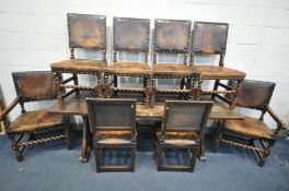 AN ANTIQUE STAINED OAK FARMHOUSE TRESTLE TABLE, the top on twin block supports, united by a single