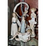 A LLADRO FIGURE OF A LADY, THREE NAO FIGURES ANOTHER SPANISH PORCELAIN FIGURE, the Lladro 'Ingenue',