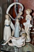 A LLADRO FIGURE OF A LADY, THREE NAO FIGURES ANOTHER SPANISH PORCELAIN FIGURE, the Lladro 'Ingenue',