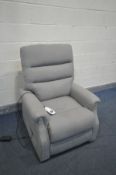 A GREY UPHOLSTERED ELECTRIC RISE AND RECLINE ARMCHAIR (condition:-some stains to the seat)