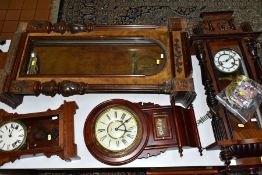SIX LATE 19TH AND 20TH CENTURY WALL CLOCKS AND CASES, including a late 19th century walnut and