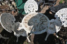 A WHITE PAINTED CAST IRON GARDEN TABLE, diameter 65cm x height 60cm and three chairs (4) (