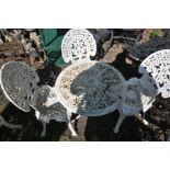 A WHITE PAINTED CAST IRON GARDEN TABLE, diameter 65cm x height 60cm and three chairs (4) (