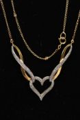 A 9CT GOLD DIAMOND NECKLACE, a modern bi colour festoon style necklace detailing an open heart and