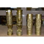 TWO PAIRS OF EARLY 20TH CENTURY BRASS TRENCH ART VASES, one pair fluted to the base, decorated