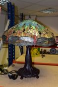 A LARGE MODERN TIFFANY STYLE LAMP, with a green, red and brown glass shade decorated with