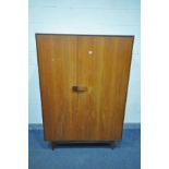 IB KOFOD LARSEN, FOR G PLAN DANISH DESIGN, a teak 1960's triple door wardrobe, with double bifold