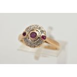 A 15CT GOLD, DIAMOND AND RUBY CLUSTER RING, of a circular design, centring on a circular cut