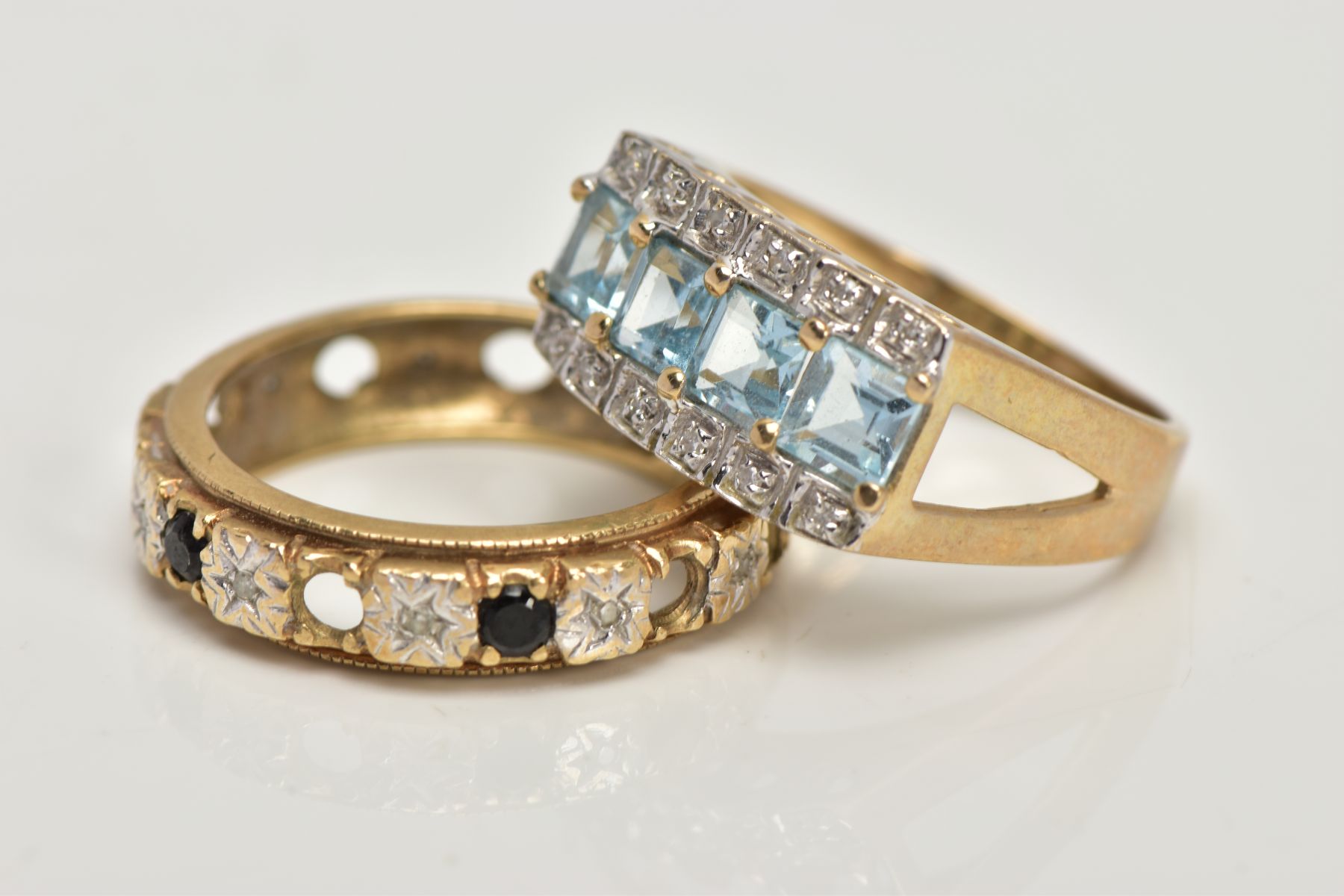 TWO 9CT GOLD GEM SET DRESS RINGS, the first centring on a row of four square cut light blue topaz, - Image 3 of 4