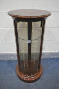 A LATE 20TH CENTURY MAHOGANY CYLINDRICAL DISPLAY CABINET, with domed glass panel, and two glass