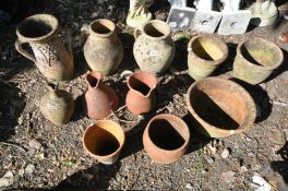 A SELECTION OF CLAY/TERRACOTTA POTTERY, to include three water jugs, three other jugs, four vases