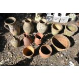 A SELECTION OF CLAY/TERRACOTTA POTTERY, to include three water jugs, three other jugs, four vases